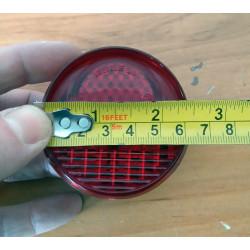 Piloto trasero redondo.